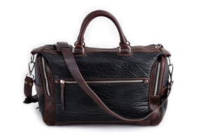 This Leather duffel bag is constructed of the finest Italian Buffalo and Vachetta leathers. It's perfect for weekend trips that securely fits in the plane overhead or under your seat or a short trip to the gym. With 6 pockets inside and out, there's a place for everything. Borlino Onyx and Walnut. 