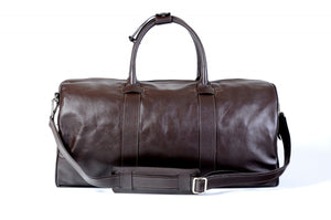 Leather Duffel Bag - This lightweight hand-crafted leather duffel bag is constructed of the finest Italian soft calf leathers. It's perfect for weekend trips that securely fits in the plane overhead. Great for a short trip to the gym or country club as well. The spacious interior also has a secure zippered pocket. Walnut Brown.
