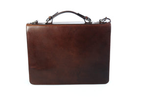 This strong leather double-gusset, key-locking briefcase is made with perfection in every detail. Handmade in Italy by Borlino of the finest Italian vegetable-tanned leathers and metals. Walnut Brown Leathers.