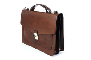 This strong leather double-gusset, key-locking briefcase is made with perfection in every detail. Handmade in Italy by Borlino of the finest Italian vegetable-tanned leathers and metals. Walnut Brown Leathers.