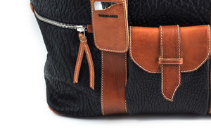 Buffalo Leather Duffel Bags Bighorn Borlino ItalyLeather Duffle - Hand-crafted of the finest Italian, vegetable-tanned Buffalo and Vachetta leathers, the Borlino Big Horn bag is great for a weekend getaway. It’s loaded with features and pockets inside and out. Easy to over pack. Borlino Italy. Onyx-Terra Tan.