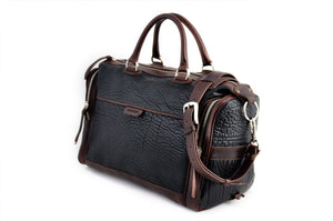 This Leather duffel bag is constructed of the finest Italian Buffalo and Vachetta leathers. It's perfect for weekend trips that securely fits in the plane overhead or under your seat or a short trip to the gym. With 6 pockets inside and out, there's a place for everything. Borlino Onyx and Walnut. 