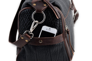 This Leather duffel bag is constructed of the finest Italian Buffalo and Vachetta leathers. It's perfect for weekend trips that securely fits in the plane overhead or under your seat or a short trip to the gym. With 6 pockets inside and out, there's a place for everything. Borlino Onyx and Walnut. 