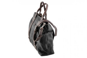 This Leather Buffalo Tote is constructed of the finest Italian vegetable-tanned Buffalo and Vachetta leathers. Each handmade tote is a one-of-a-kind. It is perfect for daily use, weekend trips or a carry-on travel bag that securely fits in the overhead or under your seat. 