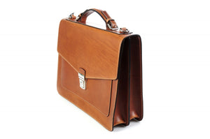 This strong leather double-gusset, key-locking briefcase is made with perfection in every detail. Handmade in Italy by Borlino of the finest Italian vegetable-tanned leathers and metals. Terra Tan Leathers.