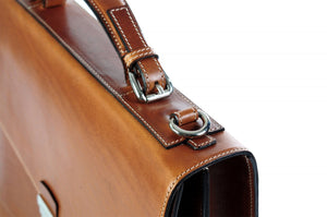 This strong leather double-gusset, key-locking briefcase is made with perfection in every detail. Handmade in Italy by Borlino of the finest Italian vegetable-tanned leathers and metals. Terra Tan Leathers.