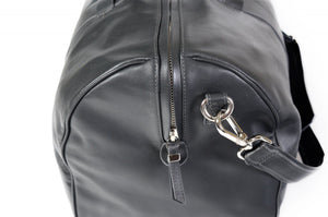 Leather Duffel Bag - This lightweight hand-crafted leather duffel bag is constructed of the finest Italian soft calf leathers. It's perfect for weekend trips that securely fits in the plane overhead. Great for a short trip to the gym or country club as well. The spacious interior also has a secure zippered pocket. Shark Grey.