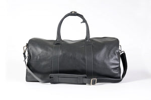 Leather Duffel Bag - This lightweight hand-crafted leather duffel bag is constructed of the finest Italian soft calf leathers. It's perfect for weekend trips that securely fits in the plane overhead. Great for a short trip to the gym or country club as well. The spacious interior also has a secure zippered pocket. Shark Grey.