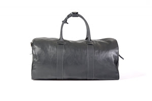 Leather Duffel Bag - This lightweight hand-crafted leather duffel bag is constructed of the finest Italian soft calf leathers. It's perfect for weekend trips that securely fits in the plane overhead. Great for a short trip to the gym or country club as well. The spacious interior also has a secure zippered pocket. Shark Grey.