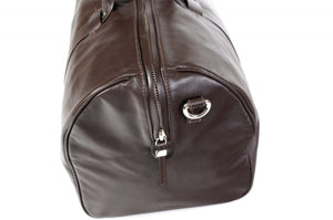 Leather Duffel Bag - This lightweight hand-crafted leather duffel bag is constructed of the finest Italian soft calf leathers. It's perfect for weekend trips that securely fits in the plane overhead. Great for a short trip to the gym or country club as well. The spacious interior also has a secure zippered pocket. Walnut Brown.