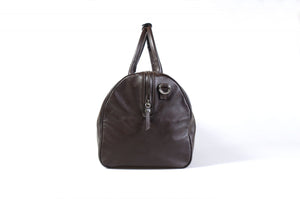 Leather Duffel Bag - This lightweight hand-crafted leather duffel bag is constructed of the finest Italian soft calf leathers. It's perfect for weekend trips that securely fits in the plane overhead. Great for a short trip to the gym or country club as well. The spacious interior also has a secure zippered pocket. Walnut Brown.