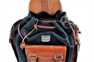 Buffalo Leather Backpack - We made the leather backpack to last for generations. It has all slide lock closures on the pockets and the top which even has a key-locking slide closure. Handmade of the finest Italian, vegetable-tanned Buffalo and Vachetta leathers, the Borlino Backpack is perfect for trips to the office or around the world. There are also additional pockets inside and a fast drawstring top all of leather.